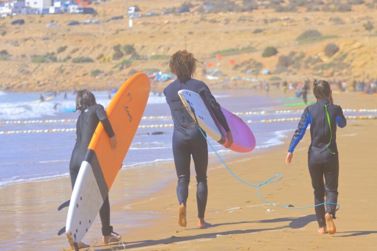 Kids surfing during a family lesson in Taghazout