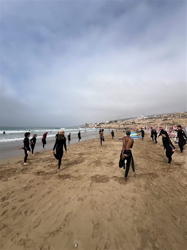 Warming up on the beach before a surf lesson near Agadir