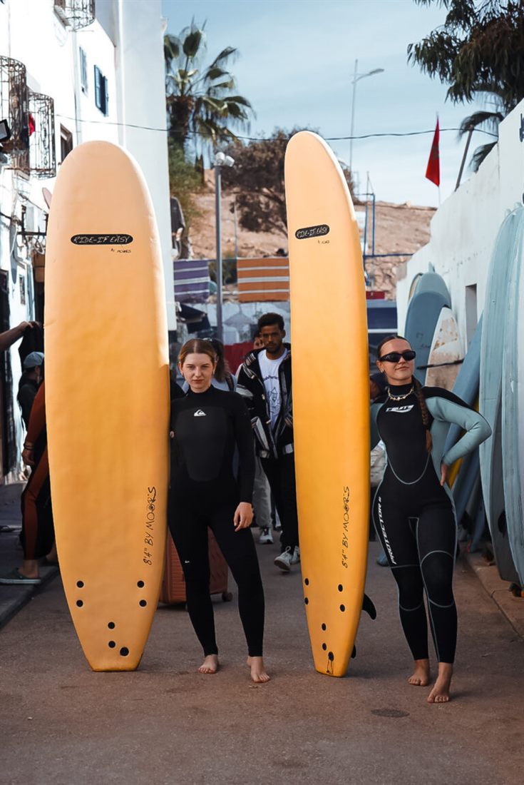 Surfers gearing up in Taghazout — what to pack for a surf trip